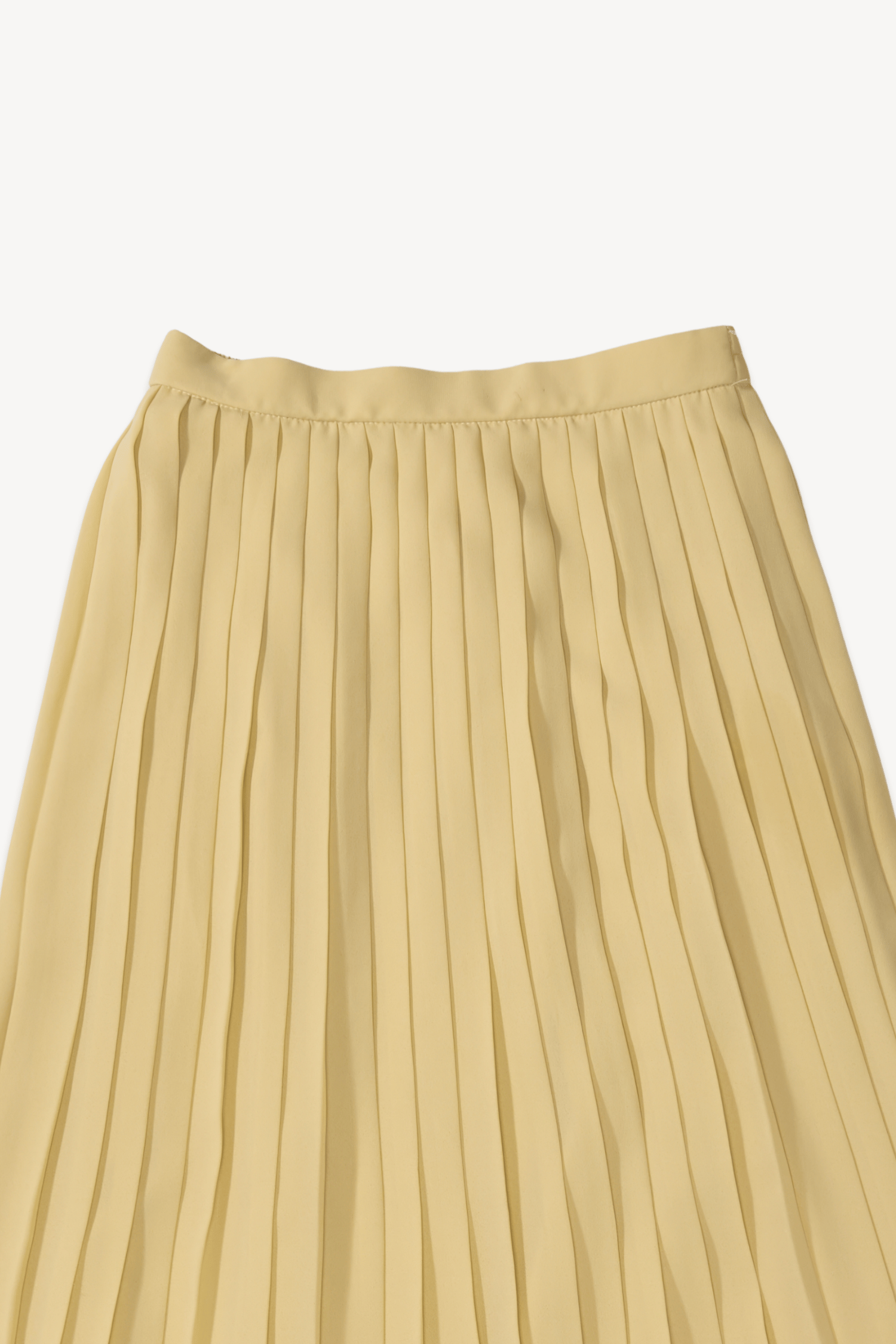 Saia plissada amarelo manteiga
